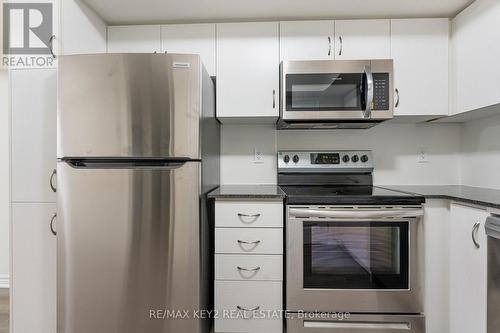 407 - 2789 Eglinton Avenue E, Toronto, ON - Indoor Photo Showing Kitchen With Stainless Steel Kitchen