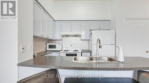 201 - 50 Brian Harrison Way, Toronto, ON - Indoor Photo Showing Kitchen With Double Sink