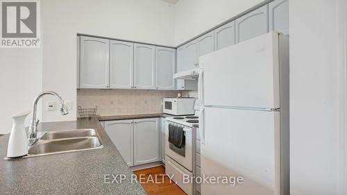 201 - 50 Brian Harrison Way, Toronto, ON - Indoor Photo Showing Kitchen With Double Sink