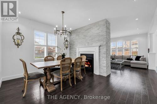 2 Leith Drive, Bradford West Gwillimbury, ON - Indoor Photo Showing Dining Room With Fireplace