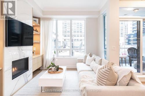 Th01 - 761 Bay Street, Toronto, ON - Indoor Photo Showing Living Room With Fireplace