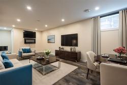 virtually staged lower unit living area - 