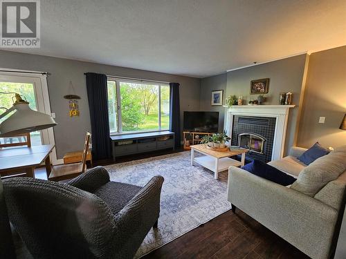 6561 Dokkie Subdivision, Chetwynd, BC - Indoor Photo Showing Living Room With Fireplace