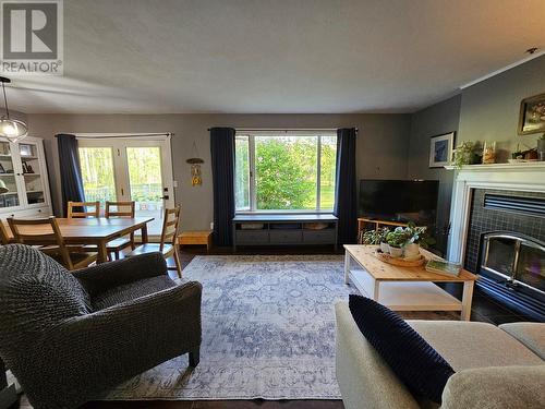 6561 Dokkie Subdivision, Chetwynd, BC - Indoor Photo Showing Living Room With Fireplace