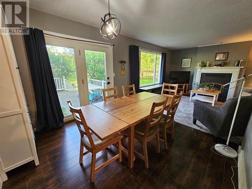 6561 Dokkie Subdivision, Chetwynd, BC - Indoor Photo Showing Dining Room With Fireplace