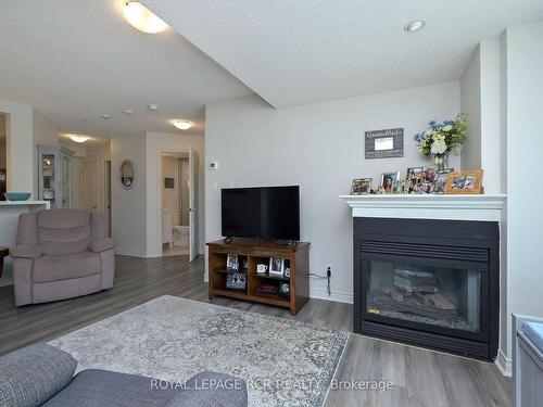 212-4 Briar Hill Hts, New Tecumseth, ON - Indoor Photo Showing Living Room With Fireplace