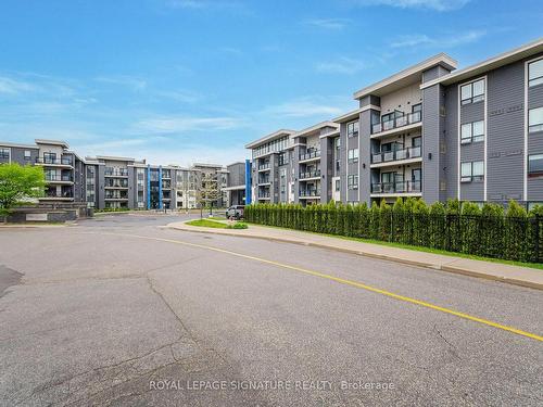 315-3170 Erin Mills Pkwy, Mississauga, ON - Outdoor With Balcony With Facade