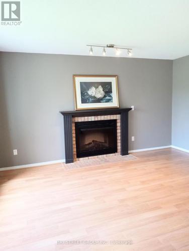 26 Mcivor Street, Whitby, ON - Indoor Photo Showing Living Room With Fireplace