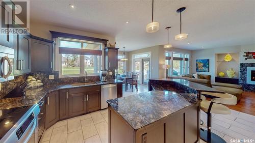 12119 Wascana Heights, Regina, SK - Indoor Photo Showing Kitchen With Fireplace