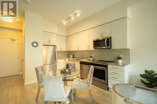 417 - 4055 Parkside Village Drive, Mississauga, ON - Indoor Photo Showing Kitchen With Upgraded Kitchen