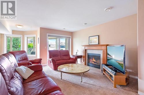 4074 Gellatly Road Unit# 107, West Kelowna, BC - Indoor Photo Showing Living Room With Fireplace