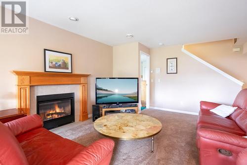 4074 Gellatly Road Unit# 107, West Kelowna, BC - Indoor Photo Showing Living Room With Fireplace