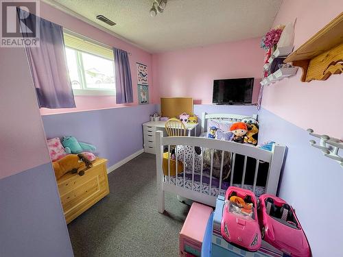 709 99 Avenue, Dawson Creek, BC - Indoor Photo Showing Bedroom
