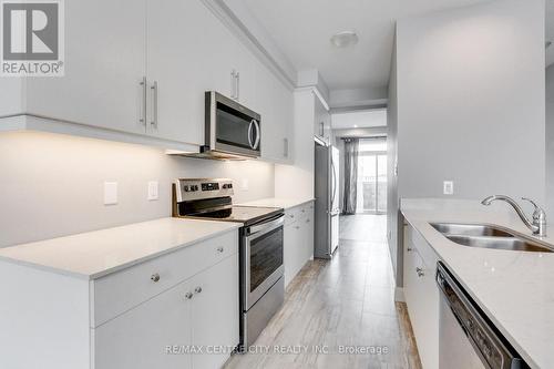 106 - 2070 Meadowgate Boulevard, London, ON - Indoor Photo Showing Kitchen With Stainless Steel Kitchen With Double Sink With Upgraded Kitchen