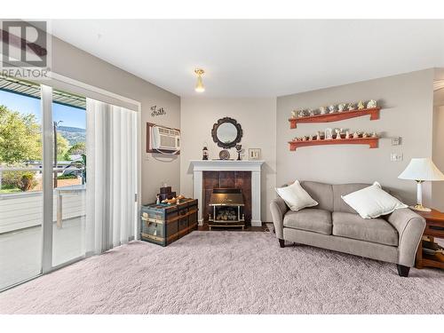 965 King Street Unit# 207, Penticton, BC - Indoor Photo Showing Living Room With Fireplace