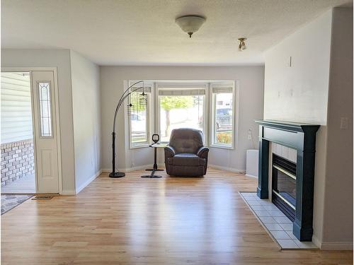 103 - 825 Merry Creek Road, Castlegar, BC - Indoor Photo Showing Living Room With Fireplace