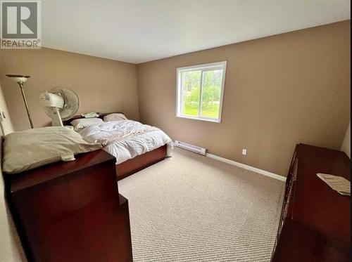 7566 Bridge Lake Business Road, Bridge Lake, BC - Indoor Photo Showing Bedroom