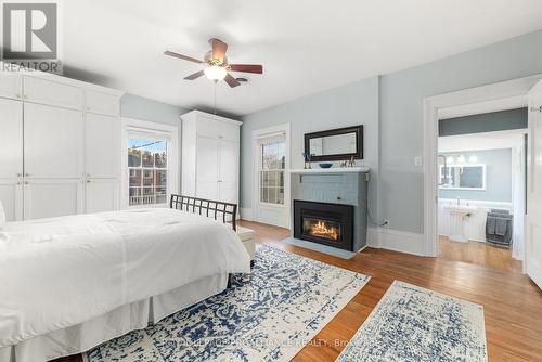 149 Bridge Street E, Belleville, ON - Indoor Photo Showing Bedroom With Fireplace