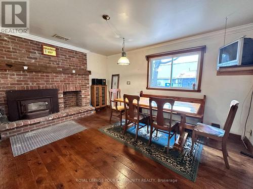 48 Market Street, Georgina, ON - Indoor Photo Showing Dining Room With Fireplace
