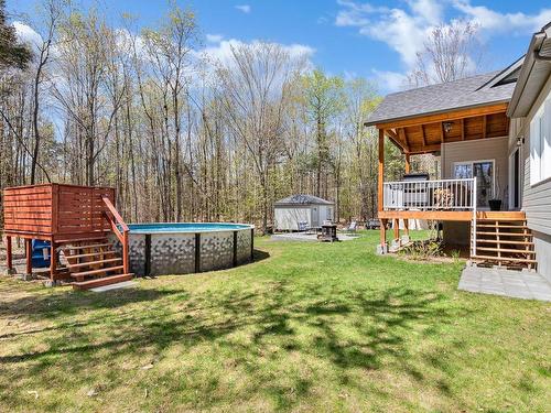 Backyard - 133 Rue Du Lac-Rinfret, Saint-Colomban, QC - Outdoor With Above Ground Pool