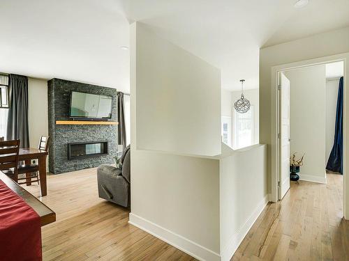 Passageway - 58 Ch. Du Fort, Saint-Hippolyte, QC - Indoor Photo Showing Other Room With Fireplace