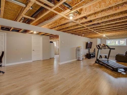 Family room - 58 Ch. Du Fort, Saint-Hippolyte, QC - Indoor Photo Showing Basement