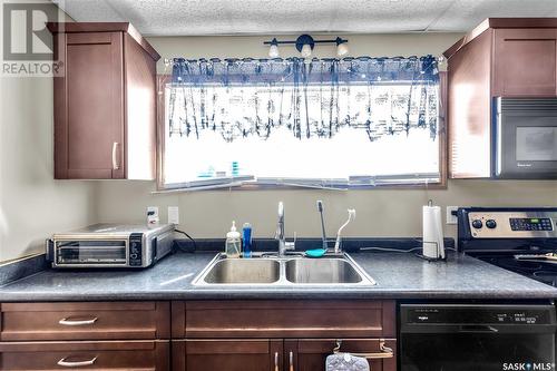 325 Witney Avenue S, Saskatoon, SK - Indoor Photo Showing Kitchen With Double Sink