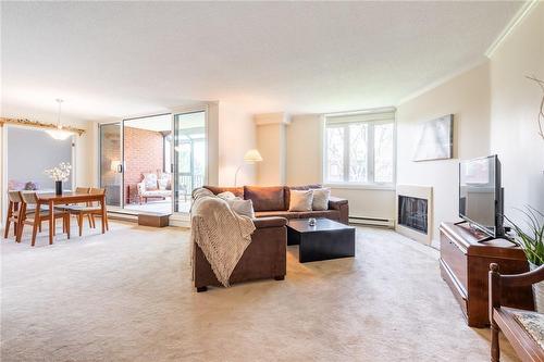 Massive unit flooded with windows and natural light - 150 Wilson Street W|Unit #305, Ancaster, ON - Indoor Photo Showing Living Room With Fireplace