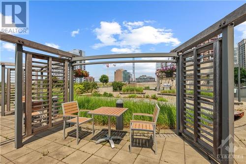 Private seating on the rooftop terrace. - 90 George Street Unit#402, Ottawa, ON - Outdoor With Deck Patio Veranda