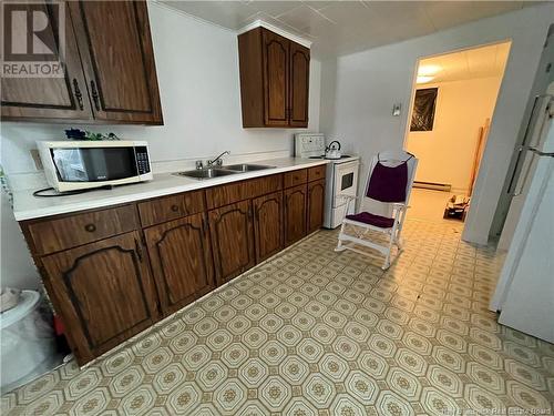 1 Veniot Street, Edmundston, NB - Indoor Photo Showing Kitchen With Double Sink