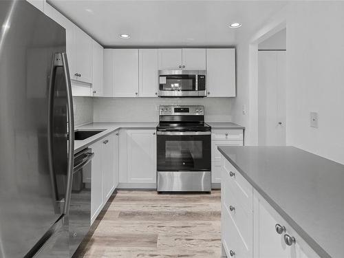 306-1012 Collinson St, Victoria, BC - Indoor Photo Showing Kitchen With Stainless Steel Kitchen