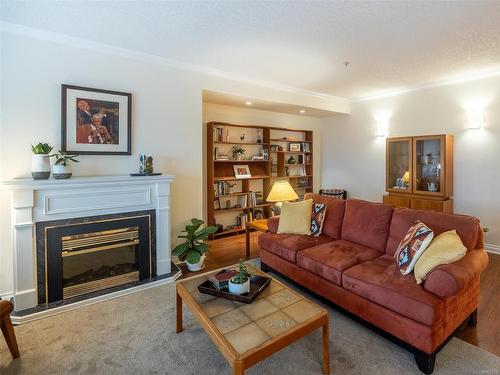 102-9960 Fourth St, Sidney, BC - Indoor Photo Showing Living Room With Fireplace