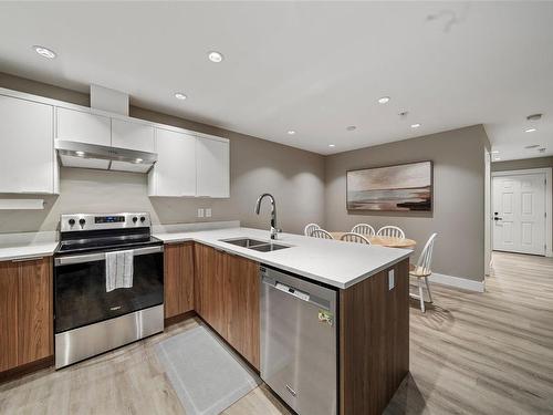 105-2096 Kennedy St, Sooke, BC - Indoor Photo Showing Kitchen With Stainless Steel Kitchen With Double Sink