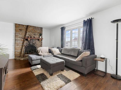 Salon - 31 Rue Casgrain, L'Ange-Gardien, QC - Indoor Photo Showing Living Room With Fireplace