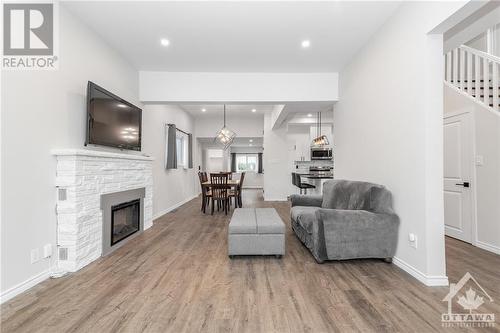 267 Sidney Avenue, Renfrew, ON - Indoor Photo Showing Living Room With Fireplace