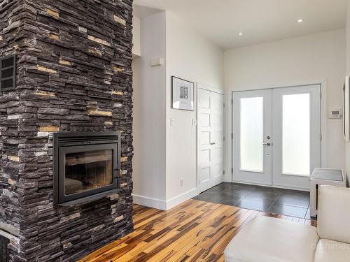 Hall - 427 Rue Des Sittelles, Saint-Colomban, QC - Indoor With Fireplace