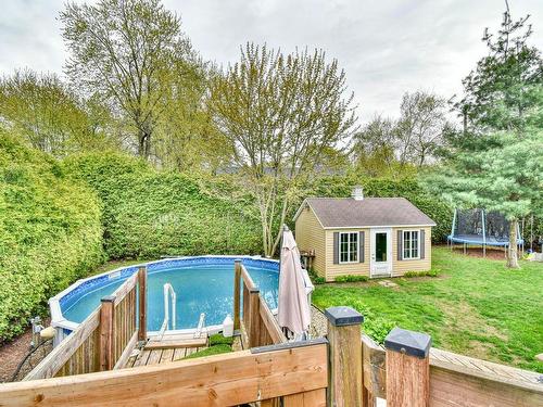 Backyard - 29 9E Avenue, Sainte-Marthe-Sur-Le-Lac, QC - Outdoor With Above Ground Pool With Backyard
