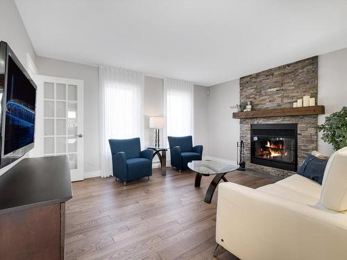 Living room - 50 Rue Yvon-Cousineau, Blainville, QC - Indoor Photo Showing Living Room With Fireplace