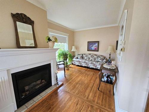 118 Front Street, Emo, ON - Indoor Photo Showing Living Room With Fireplace