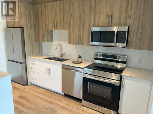 412 - 525 New Dundee Road W, Kitchener, ON - Indoor Photo Showing Kitchen With Stainless Steel Kitchen With Double Sink