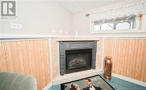66 Nevers Road, Lincoln, NB - Indoor Photo Showing Living Room With Fireplace