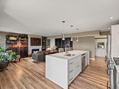 557 Harrogate Lane, Kelowna, BC - Indoor Photo Showing Kitchen With Fireplace