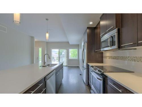1-3626 Mission Springs Drive, Kelowna, BC - Indoor Photo Showing Kitchen With Double Sink