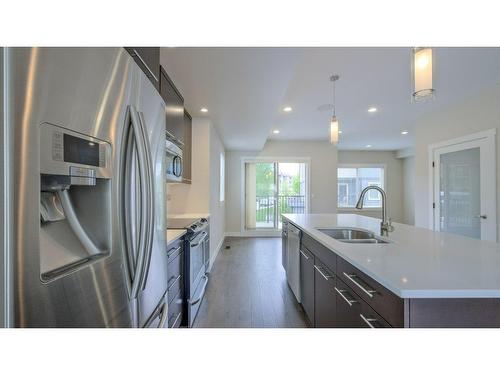 1-3626 Mission Springs Drive, Kelowna, BC - Indoor Photo Showing Kitchen With Double Sink With Upgraded Kitchen