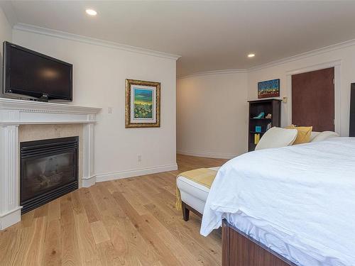 5075 Clutesi St, Saanich, BC - Indoor Photo Showing Bedroom With Fireplace