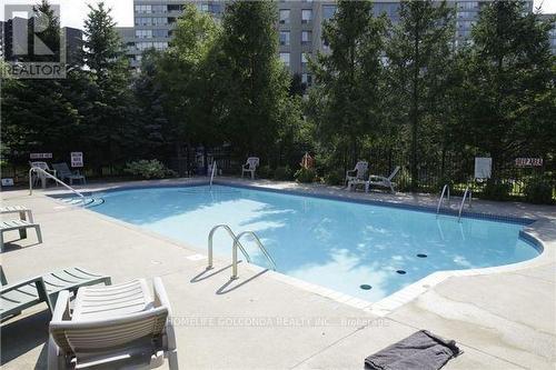 506 - 81 Townsgate Drive, Vaughan, ON - Outdoor With In Ground Pool With Backyard