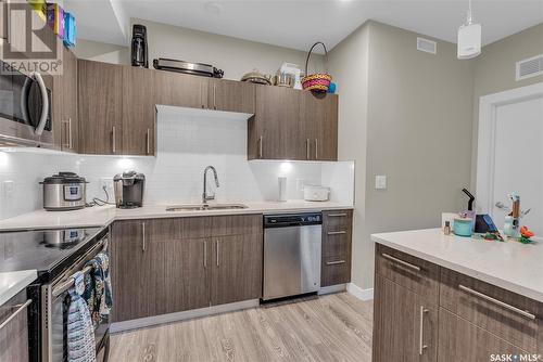 108 142 Pawlychenko Lane, Saskatoon, SK - Indoor Photo Showing Kitchen With Stainless Steel Kitchen With Double Sink
