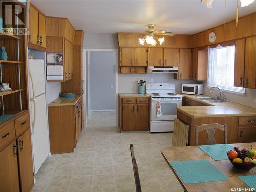 110 1St Street N, Lampman, SK - Indoor Photo Showing Kitchen With Double Sink