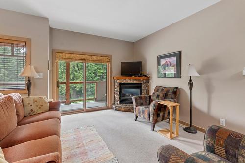 C - 1003 Mountain View Road, Rossland, BC - Indoor Photo Showing Living Room With Fireplace