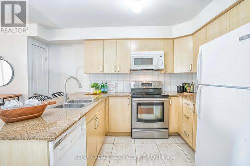 301 - 7405 Goreway Drive, Mississauga, ON - Indoor Photo Showing Kitchen With Double Sink